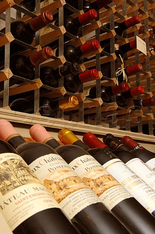 Bottles of Bordeaux wine and wine rack