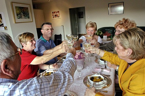 Raising a toast at a family meal