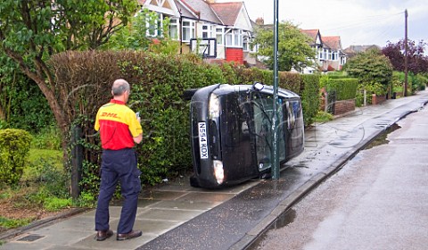 Overturned car on pavement London England