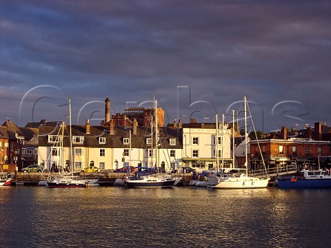 Multicoloured houses lining the harbour at Weymouth Dorset England