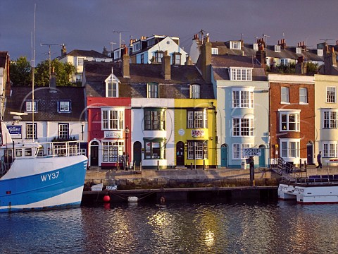Multicoloured houses lining the harbour at Weymouth Dorset England