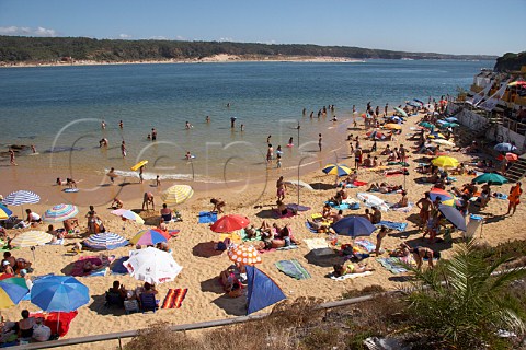 People on the beach by the Mira River estuary at Vila Nova de Milfontes Odemira Portugal