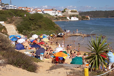 People on the beach by the Mira River estuary at Vila Nova de Milfontes Odemira Portugal