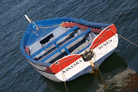 Small fishing boat moored on the Mira River estuary at Vila Nova de Milfontes Odemira Portugal