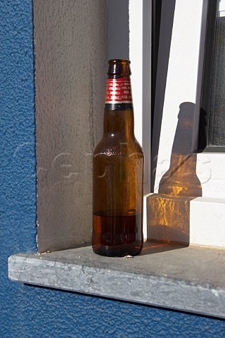 Bottle of beer on window ledge Vila Nova de Milfontes Odemira Portugal