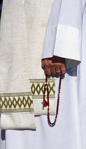 Catholic priest holding rosary beads Almograve Odemira Portugal