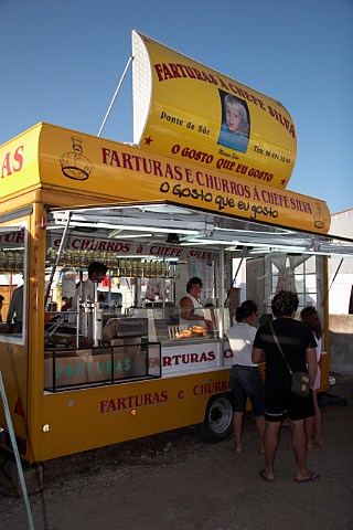 A snack bar selling farturas a Portuguese delicacy of deep fried dough with Port wine and cinnamon sugar and churros a frieddough pastry based snack Almograve Odemira Portugal