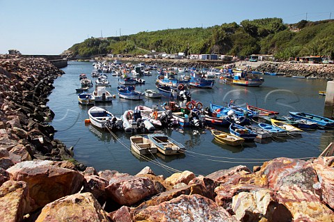 Fishing boats moored in the harbour at Vila Nova de Milfontes Odemira Portugal