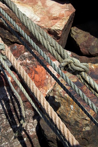 Mooring ropes on harbour rocks Vila Nova de Milfontes Odemira Portugal