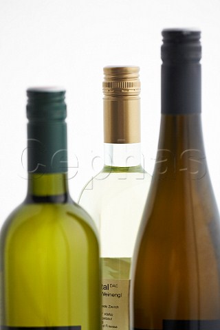 Three white wine bottles with screwcap closures