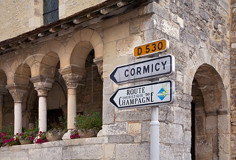Sign for Cormicy and the Route Touristique du Champagne by the church in the village of CauroylsHermonville to the northwest of Reims the most northerly villages of Champagne Marne France