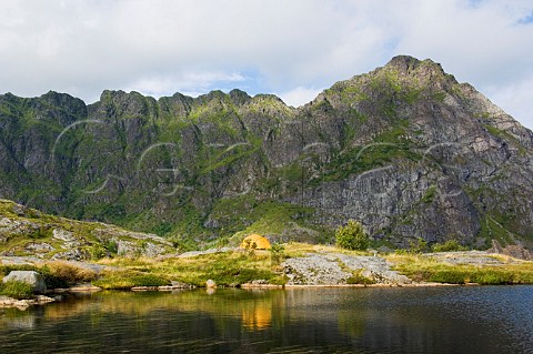 Tent and mountain tarn Lofoten Islands Norway