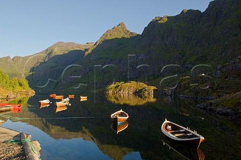 Rowing boats on lake village of  Lofoten Islands Norway