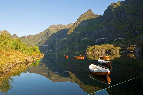 Rowing boats on lake village of  Lofoten Islands Norway