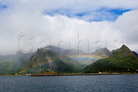 Rainbow over mountains near Kabelvg Lofoten Islands Norway