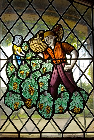 Stained glass window depicting historic wine worker with Burgundian basket LAlambic caveau and restaurant NuitsStGeorges Cte dOr France