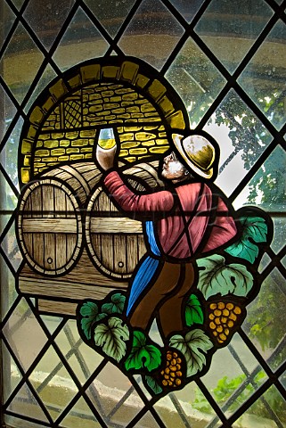 Stained glass window depicting ancient wine making techniques in the caveau and restaurant LAlambic NuitsStGeorges Cte dOr France
