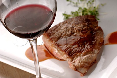 Lamb steak with a glass of red wine