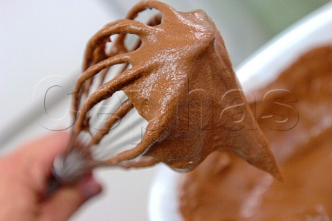 Chocolate cake mix on a whisk
