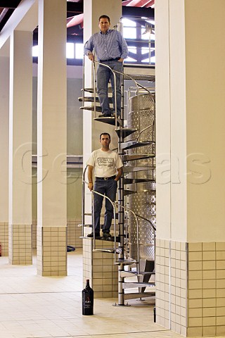 Coowner Angelos Iatridis top and winemaker Antonis Kioseoglou in the production hall of Alpha Estate winery Amyndeon Macedonia Greece Amyndeon