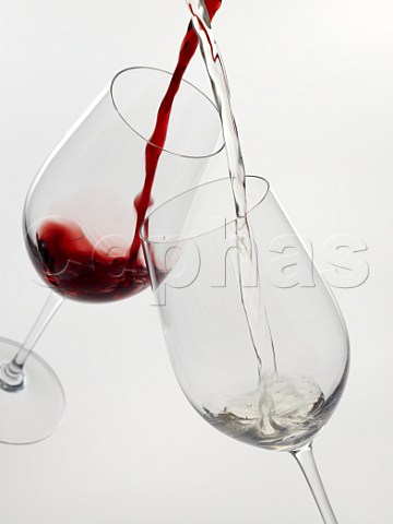 Pouring glasses of red and white wine