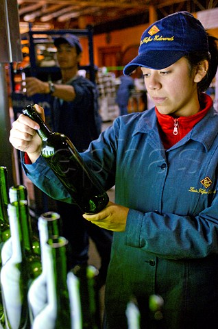 Inspecting wine bottles at Luis Felipe Edwards winery Colchagua Valley Chile Rapel