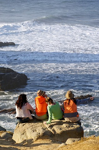 Girls looking out to sea at the surfing beach of Punta de Lobos near Pichilemu Cardenal Caro Chile