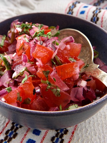 Dish of fresh red pepper and onion salad