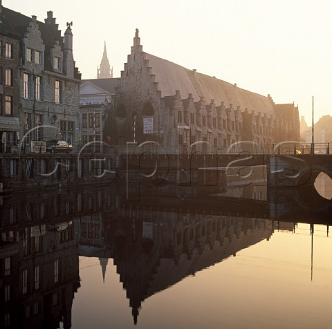 Meat Market Hall circa 14061410 reflected in the River Leie Ghent Flanders Belgium