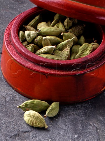 Cardamoms in a wooden bowl