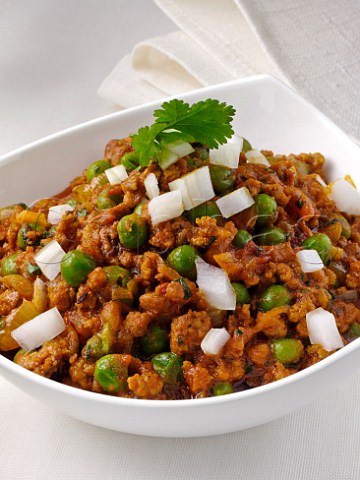 Indian minced lamb with chopped raw onion and peas