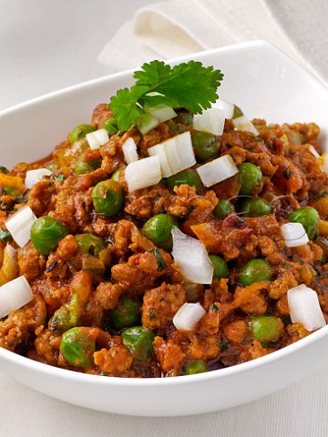Indian minced lamb with chopped raw onion and peas