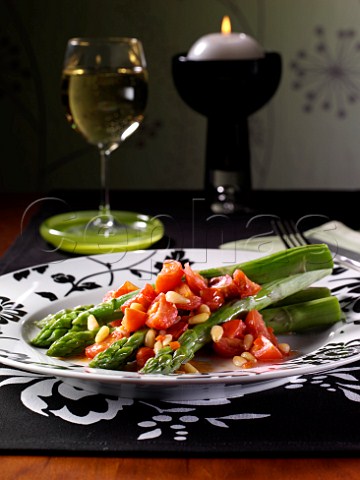Asparagus and tomato salad with pinenuts