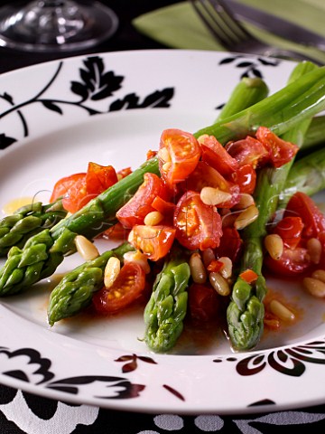 Asparagus and tomato salad with pinenuts