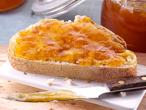 Slice of sourdough bread with apricot and ginger jam