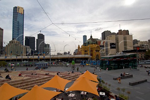 Umbrellas covering alfresco caf seating in Federation Square Melbourne Victoria Australia