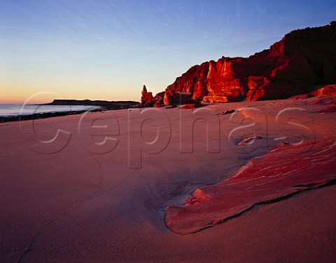 Red cliffs and beach at sunset Cape Leveque Western Australia