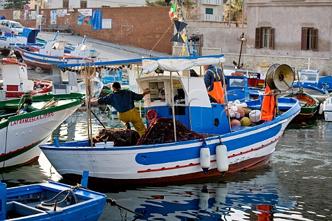 Small fishing boat in Favignana harbour Favignana Island near Trapani Sicily Italy