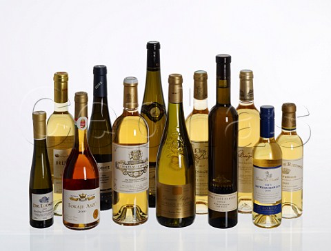 Bottles of sweet wines from different countries regions and grape varieties Germany Mosel Rheingau Hungary Tokaji France Sauternes Barsac Alsace Gaillac Monbazillac Coteaux du Layon South Africa Cape Point Australia Riverina