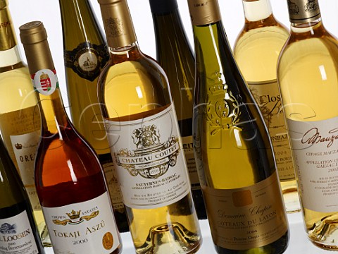 Bottles of sweet wines from different countries regions and grape varieties  Germany Mosel Rheingau Hungary Tokaji France Sauternes Barsac Alsace Gaillac Monbazillac Coteaux du Layon