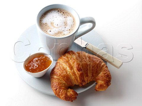 French croissant cappuccino and orange jam