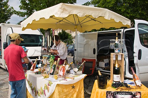 Market stall on Quai des Chartrons selling Champagne Bordeaux Gironde France