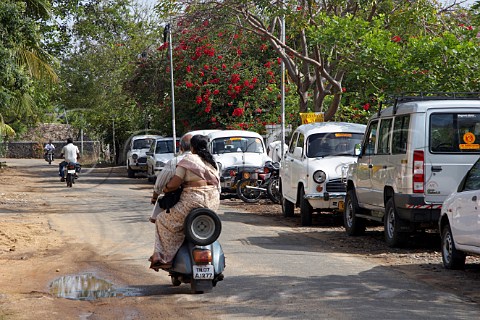 Indian woman travelling on the back of a scooter Laxmana Nagar Kottivakkam Chennai Madras India