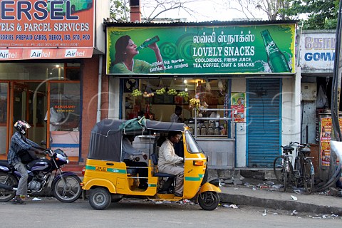 Auto rickshaw parked outside a snack and refreshment store Chennai Madras India