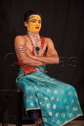 A Kathakali artist gives a demonstration of movements before a play is performed at the Kerala Kathakali traditional art form of Kerala Centre Fort Cochin Kochi Cochin Kerala India