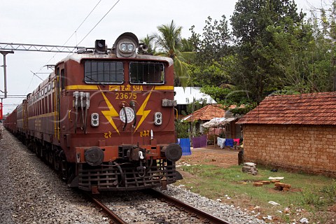 Train on the tracks between Kochi Cochin and Kannur Cannanore Kerala India