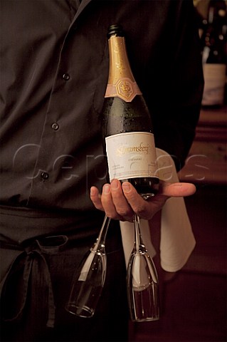 Sommelier holding bottle of Schramsberg sparkling wine Calistoga Napa Valley California