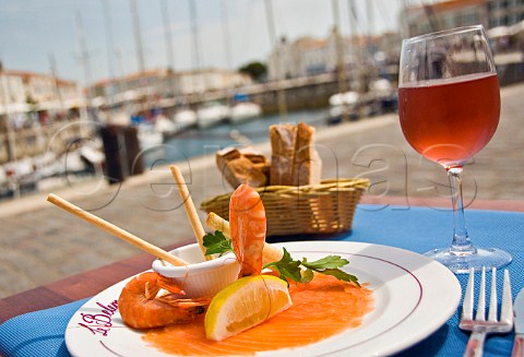 Seafood starter and ros wine at harbour front restaurant StMartindeR Ile de R CharenteMaritime France PoitouCharentes