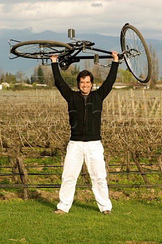 Adolfo Hurtado winemaker with bike in organic Cabernet Sauvignon vineyard of Cono Sur Chimbarongo Colchagua Valley Chile