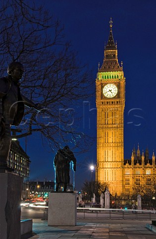 Silhouette of Sir Winston Churchill statue in Parliament Square with Big Ben St Stephens Tower at night Westminster London